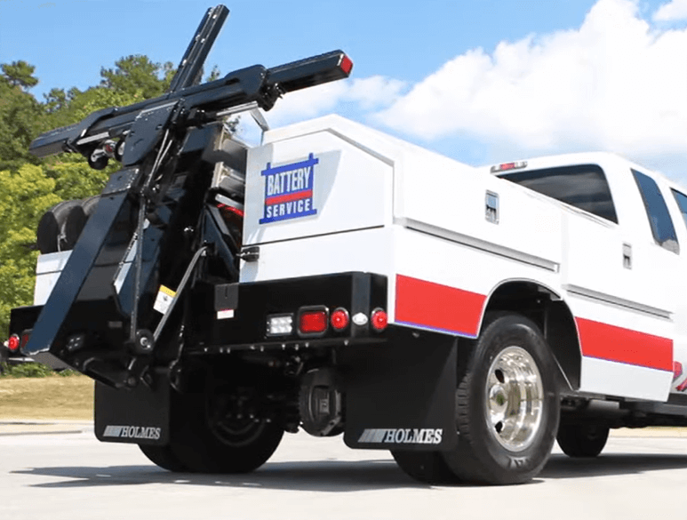 Tow truck for mobile battery service and sales